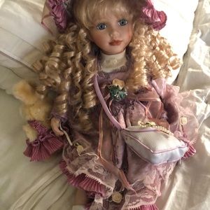 Porcelain doll approx 12”.